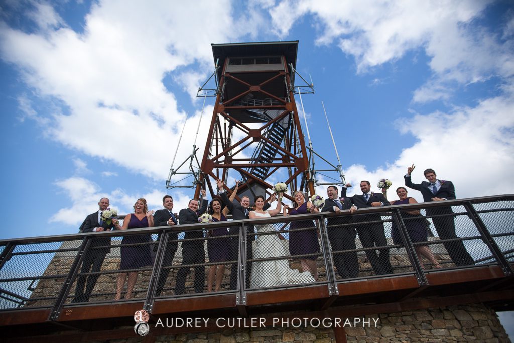 Fun Bridal party at the top of Wachusett Mountain with vibrant sky