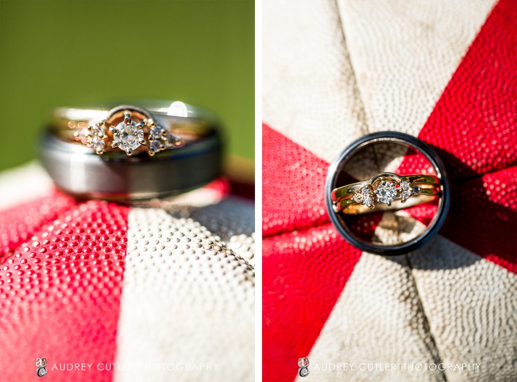Amber and Joe's wedding rings on their rugby ball - © Audrey Cutler Photography 2014