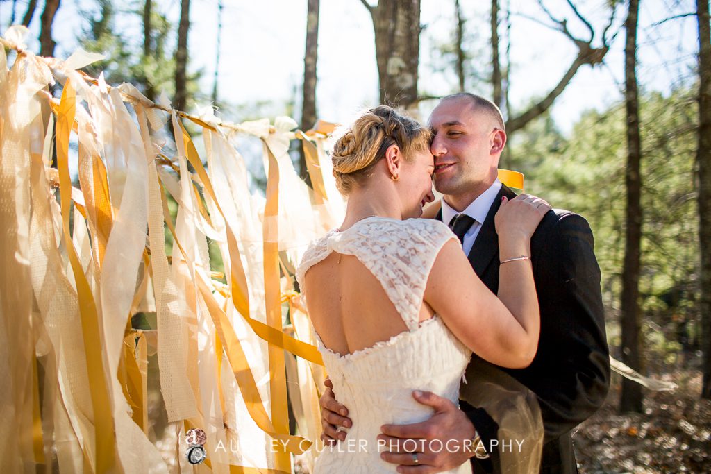 Couple with their DIY gold and yellow vibrant wedding streamers - © Audrey Cutler Photography 2014