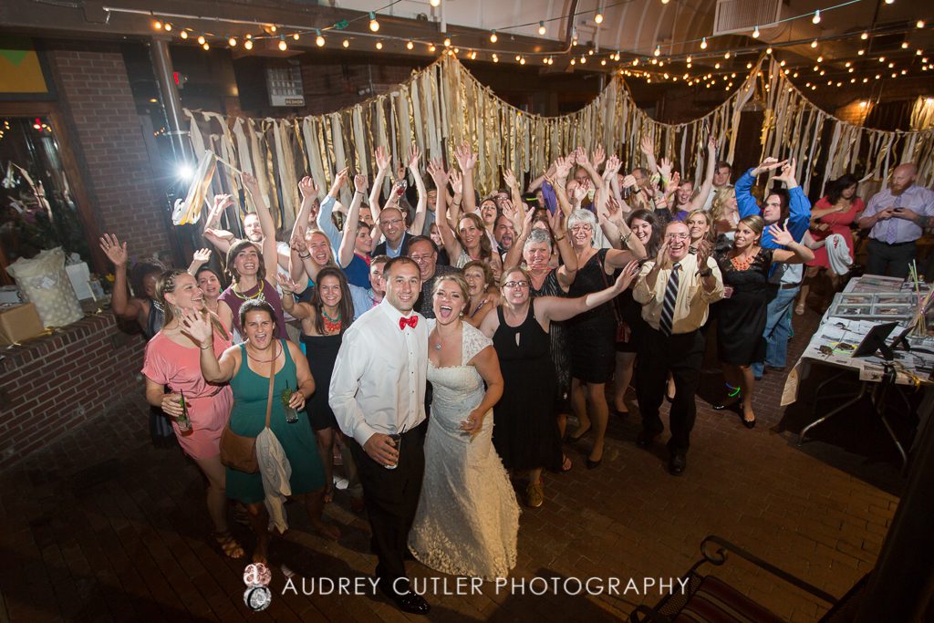 Group shot of the Party on the dance floor at a Vibrant Wedding at The People's Kitchen - The Citizen - Worcester Massachusetts Wedding