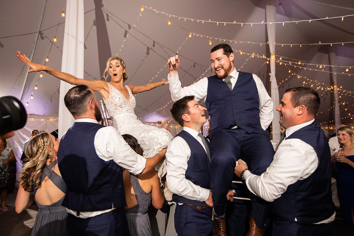 bride-and-groom-lifted-in-chairs-hora-hava-nagila