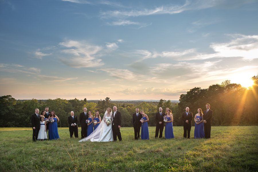 wedding-party-in-meadow-at-sunset-harrington-farm