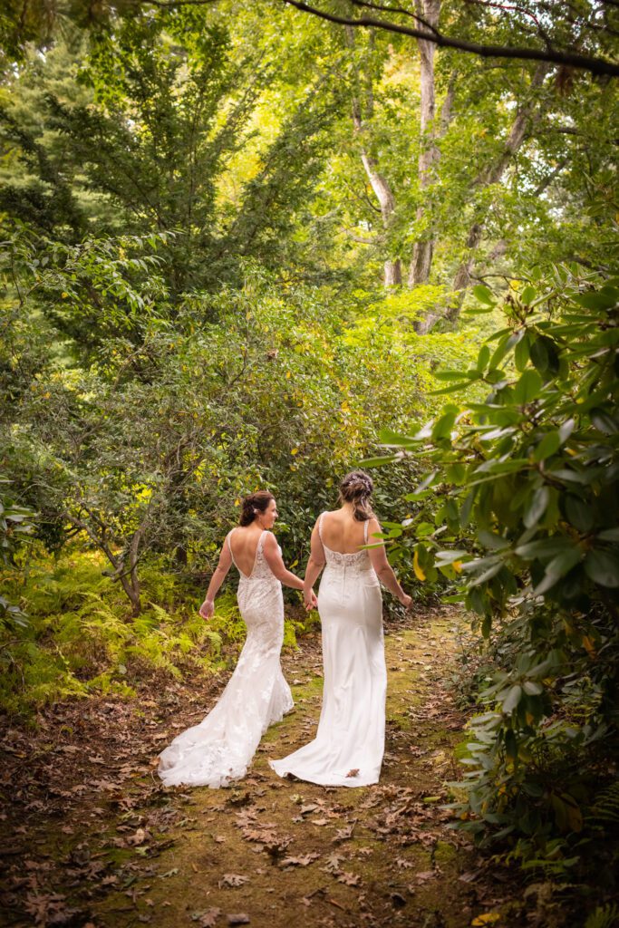lgbt-couple-walking-through-woods-wedding-audrey-cutler-photography