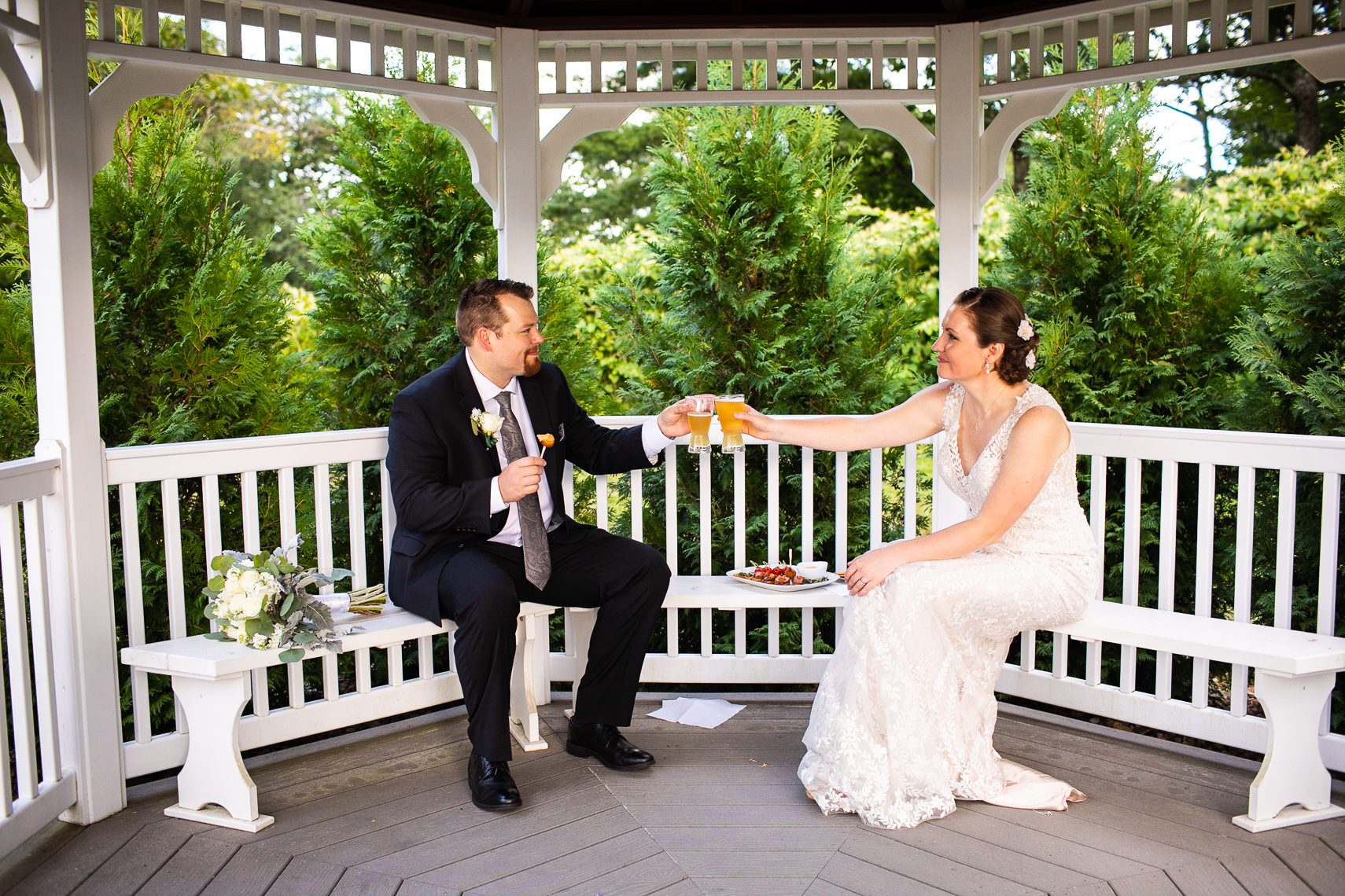 bride-and-groom-cheers-on-wedding-day-massachusetts