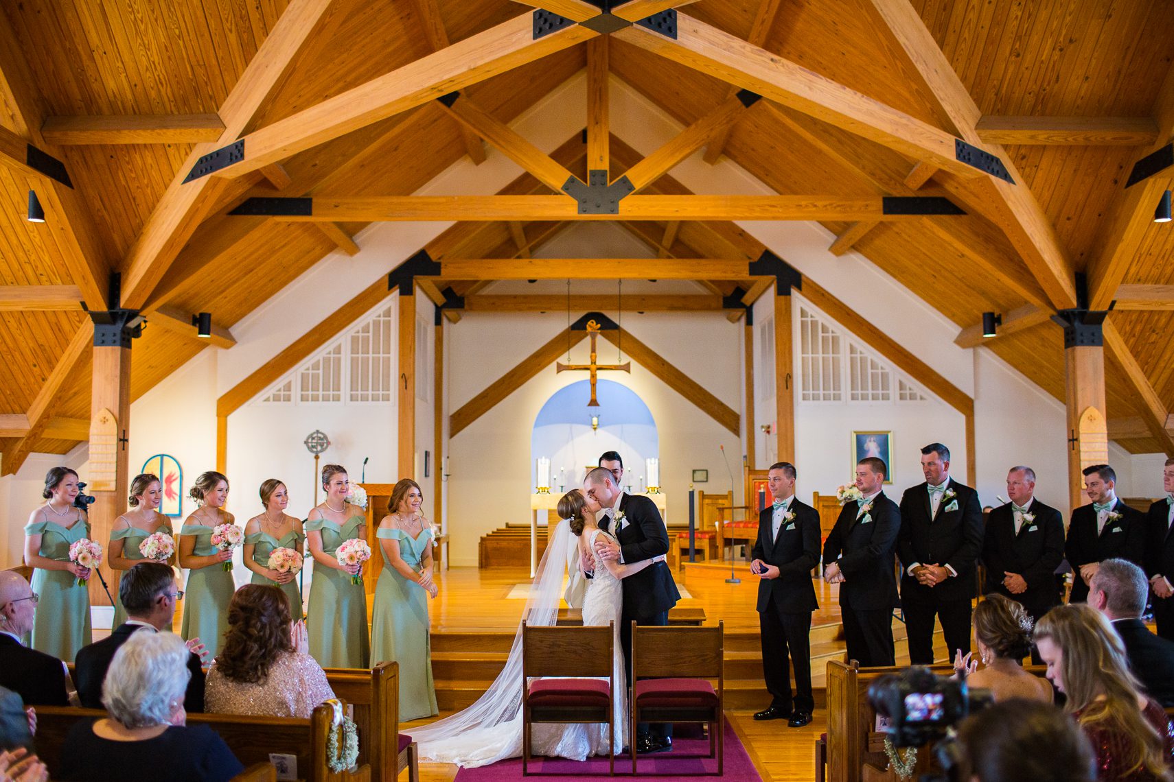 Bride-and-groom-first-kiss-church-Wedding-Day-Photography-Timeline-ceremony-worcester-ma