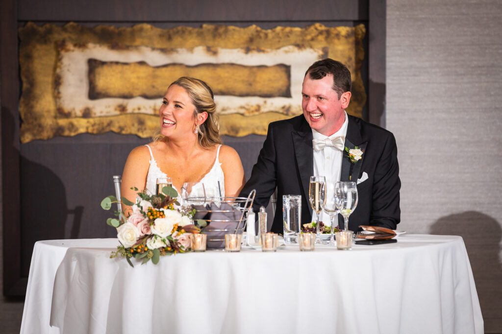 bride-and-groom-laughing-at-wedding-reception