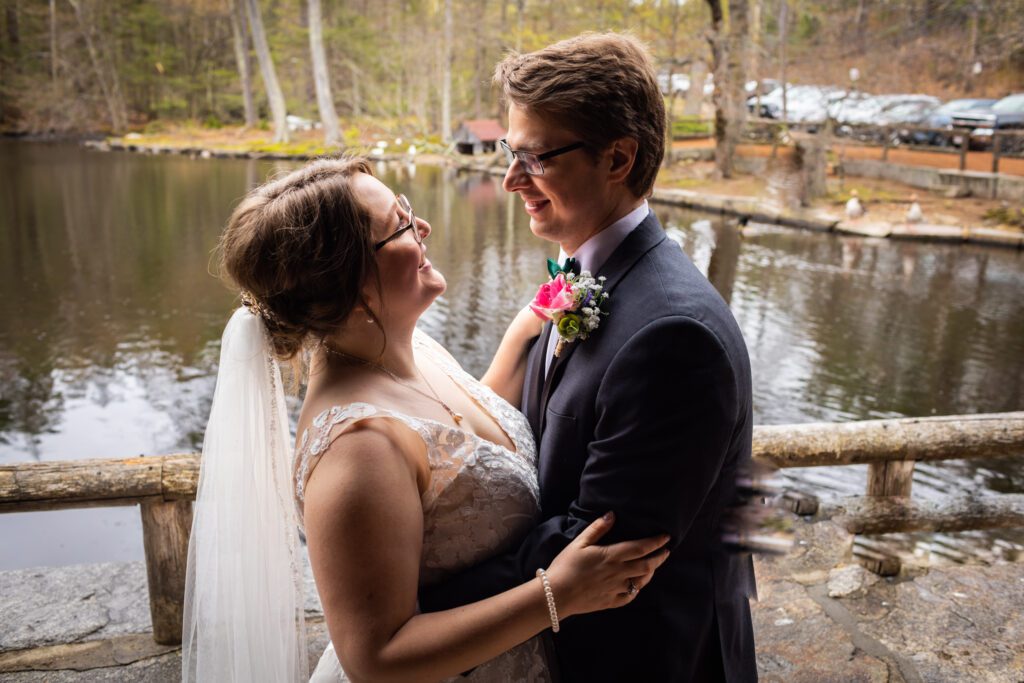 couple-in-front-of-pond-westminster-ma-wedding-