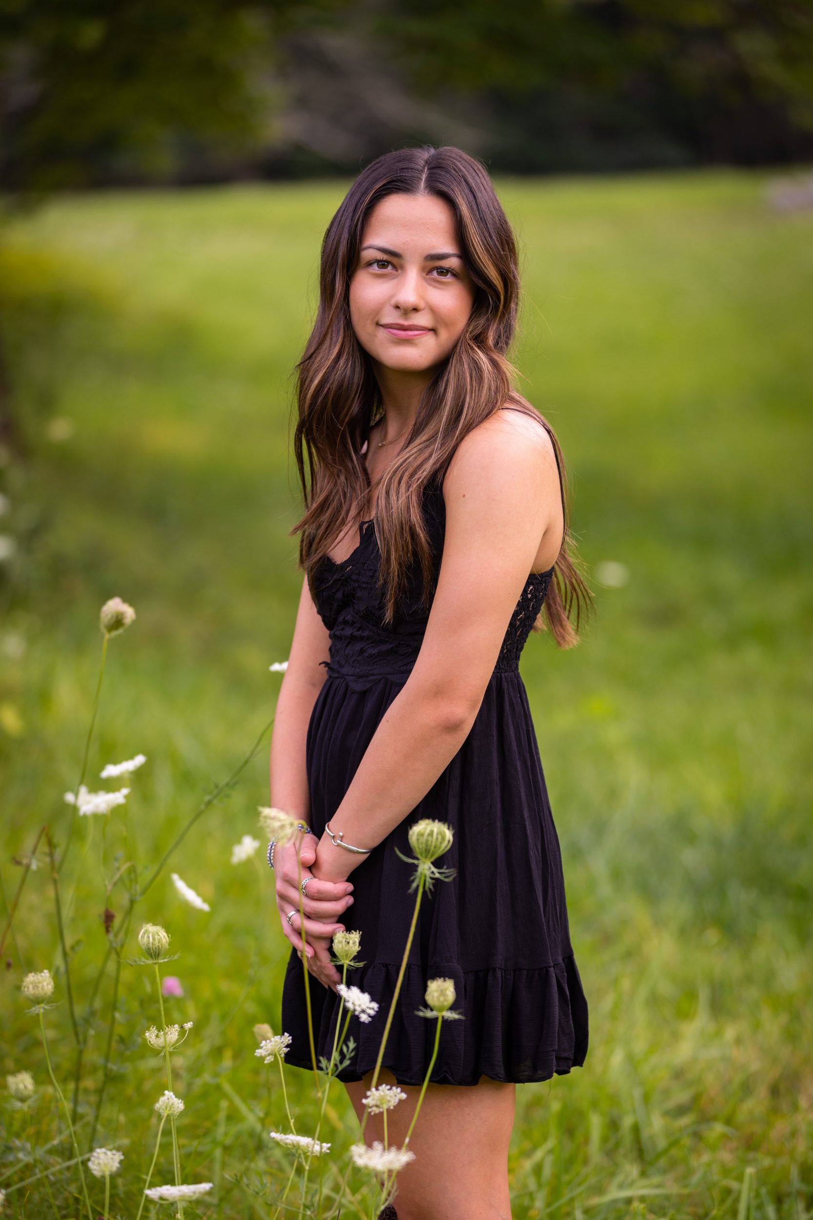Girl in field of queen Ann’s lace for high-school-senior-photos-audrey-cutler-photography
