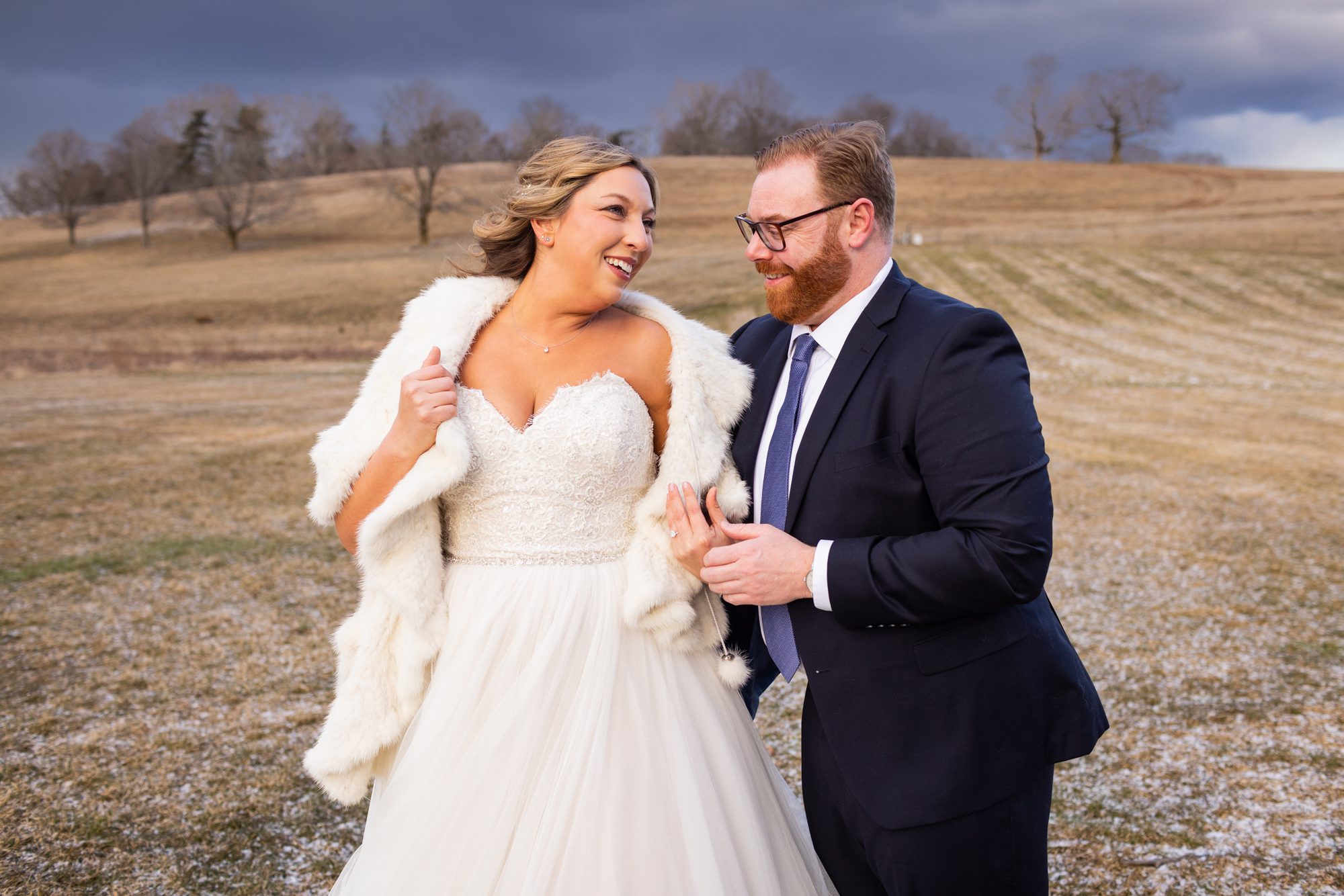 classic winter white wedding in new england bride with fur coat