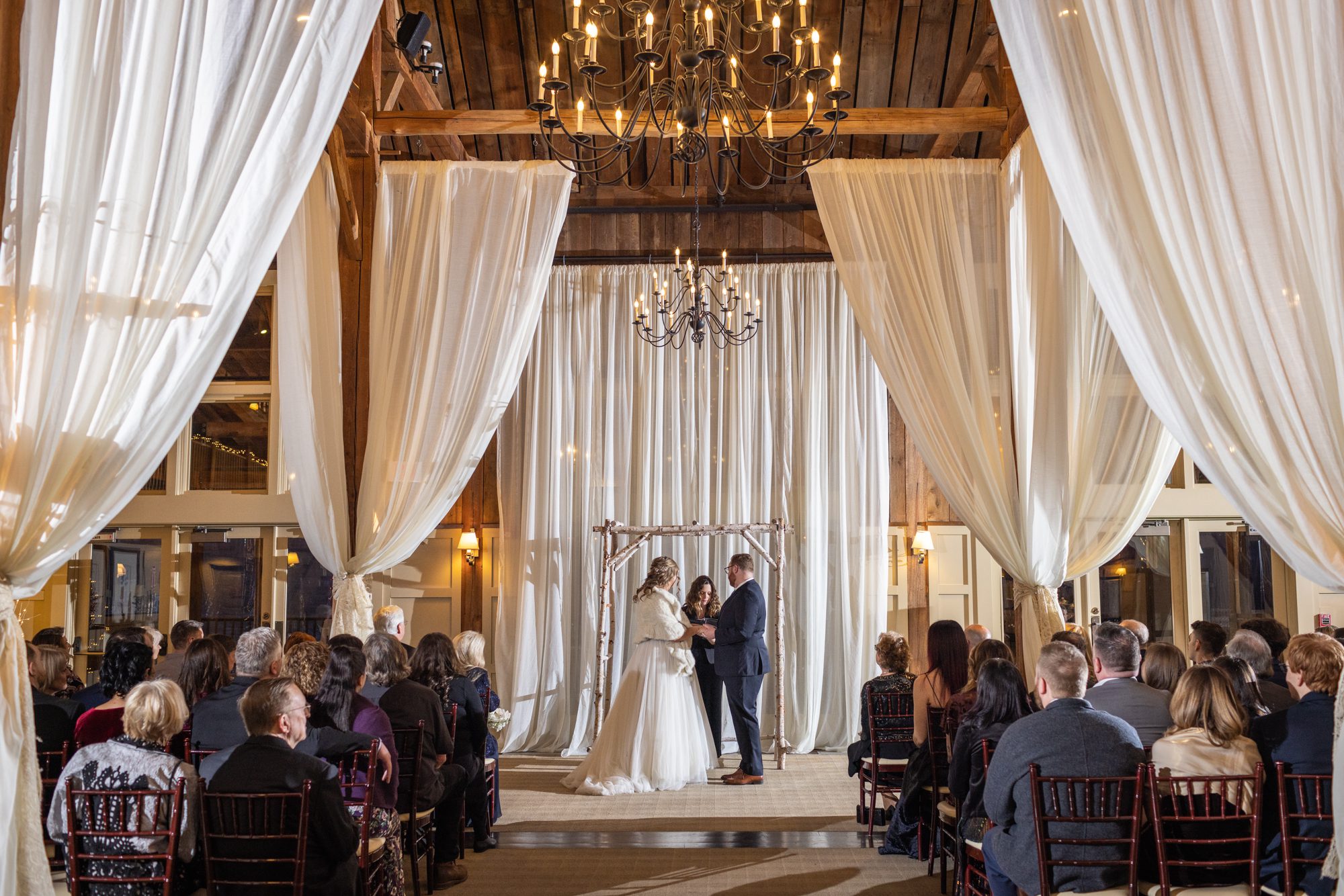 indoor winter white ceremony at gibbet hill