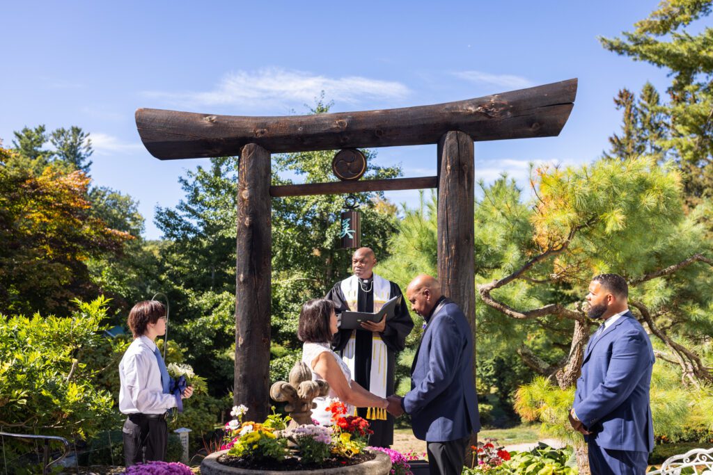 Massachusetts small wedding at home with couple marrying in front of torii gate