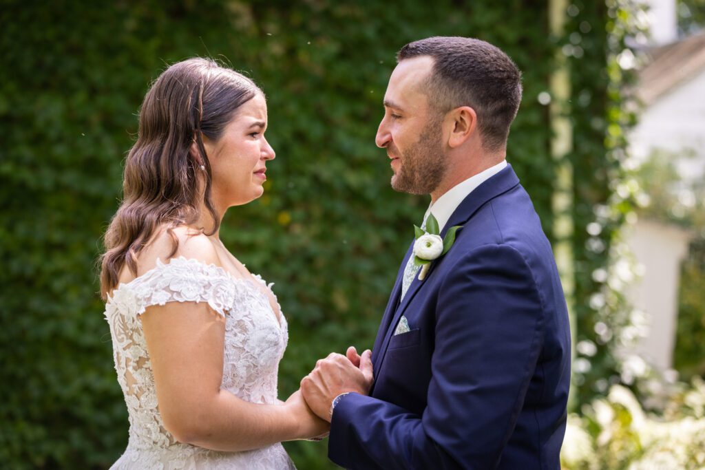 couple embrace  and cry tears of joy during private first look How to Plan Your Wedding Without Losing Your Mind 