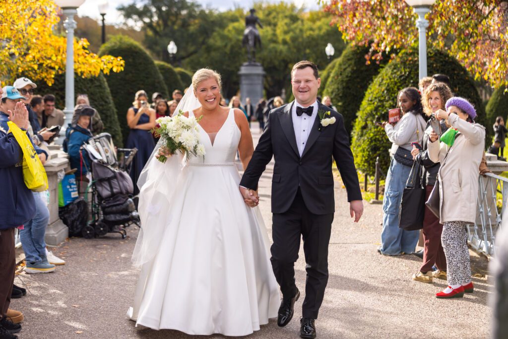 How to Book Wedding Vendors in the Age of AI. laughing couple walking through boston common